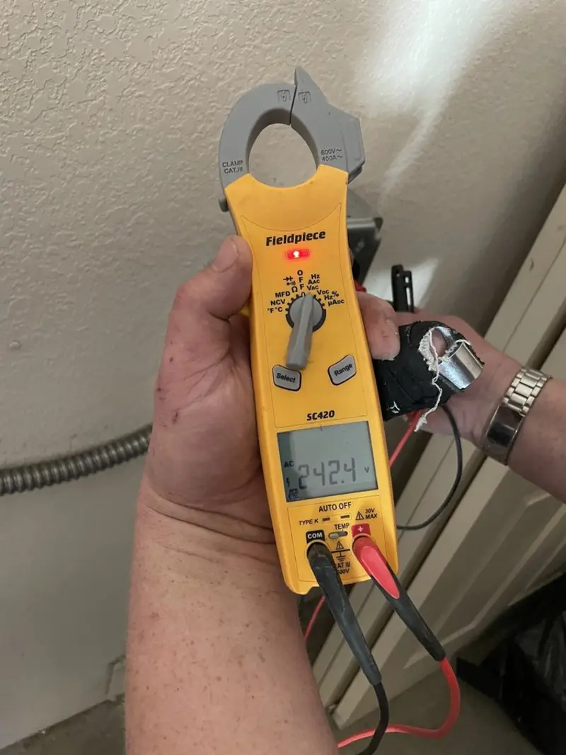 Voltage testing with clamp meter during Electrical Installation Services in Beavercreek
